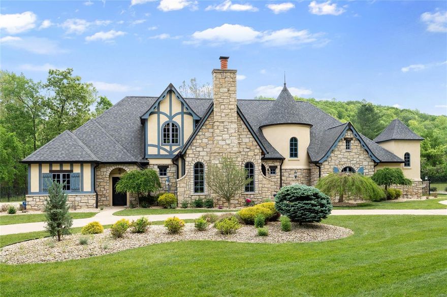 Magnificent European Estate with impressive features offering stone columns, custom cabinets, elegant floors throughout plus a 4-car garage! Located in a private subdivision w/ iron gates. The sellers have done some incredible updates throughout! Elegant dining room with massive table & chairs (stay) & stone fireplace ceiling to floor, opens to the great room with upgraded floors and fireplace. Designer kitchen offers custom made cabinets, huge center island, backsplash, commercial grade appliances, stone counters & adjoins the breakfast room which overlooks a covered patio with stone columns & fireplace. Gorgeous mast bed retreat with designer ceiling 
huge shower w/tub. Completing the main floor is a additional bedroom, walk in custom pantry and laundry room. Upstairs has a loft, additional laundry rm and 3 bedrooms. The w/o lower level has a custom walk behind wet bar, cust. cabinets, family room with fireplace, game room plus guest suite.