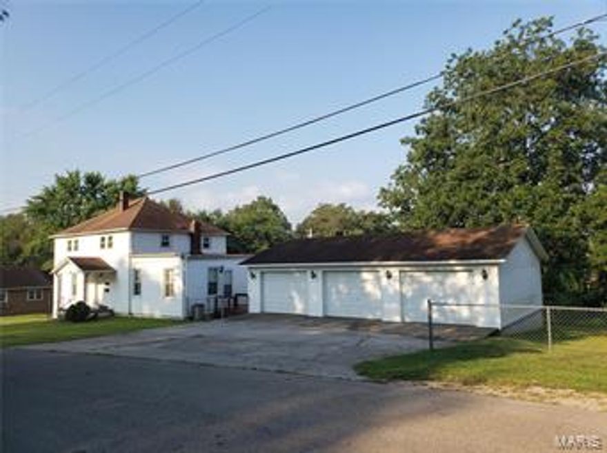 This is a large, unique house that can be used in several different ways. This would be a great house for the large family that needs extra room or could be used as an income producing property. The main level has 2 bedrooms, 1 bath, kitchen, laundry, and living room. The upper has a separate entrance to a 2 bedroom, 1 bath, kitchen, living room area. The lower level has a separate entrance and is unfinished, but is roughed plumbed for a 3rd unit of 2 bed, 1 bath, kitchen, and living room. Also included is a finished 3 car detached 40x26 shop/garage that has separate central heat and air.