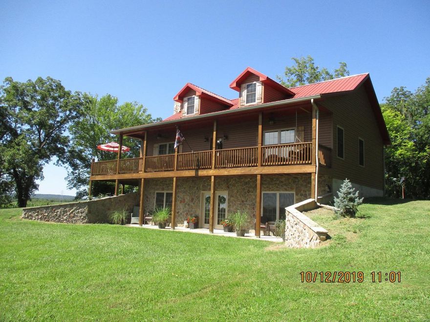 I'm so excited to announce this new listing custom built beautiful inside and out ranch home sitting on slight incline with amazing view of pond and the American flag. This home is a must see to appreciate custom built with great thought to detail and craftmanship. Truly a dream come true so peaceful relaxing with amazing views and along with overall well maintained home and grounds. Pictures cant hold a candle to the actual viewing throughout. Built in 2013 once you walk thru the door you think it was just built yesterday. The sellers cut no corners or expensive with this home. Open floor plan main level  with master suite, living , dining kitchen, laundry room and half bath just off the attached garage . Basement is finished with bedroom, family room, full bathroom, storage room walkout to the patio and a breathtaking view. Country living within 10 minutes to city limits and within an hour to the city life we dream to leave for peaceful country living.