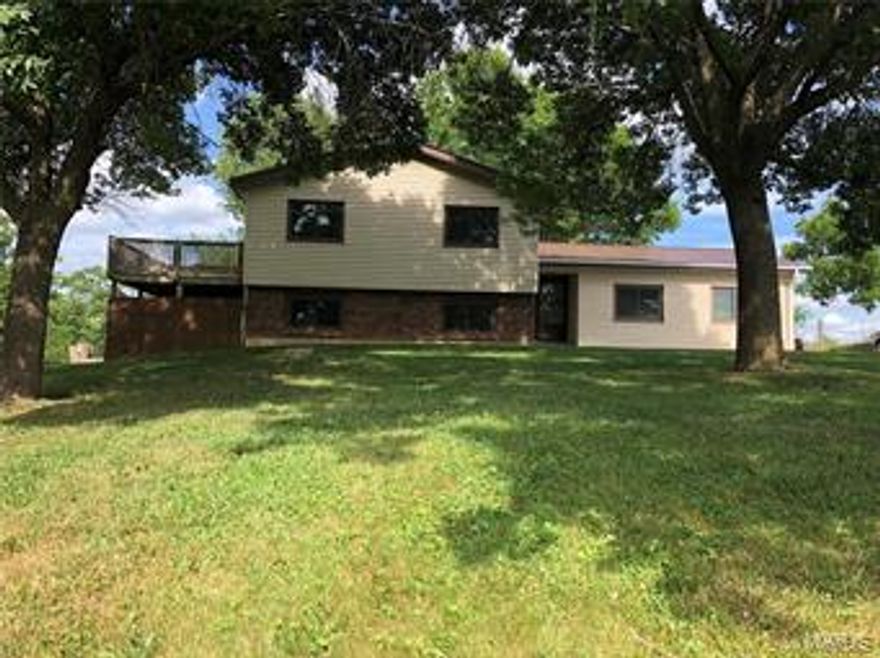 Located in the country, but only a couple of minutes from Hannibal you will find this like new home! Built in 1984 yet the only thing 1984 about this home is the wall studs and the concrete. All new everything! It's like moving into a brand new home without the brand new price. Four bedrooms and two baths allows room to raise a family with ease. Country living setting with a spacious yard and a pond. Two car garage with a detached two car garage, allow room for the family vehicles and your play toys , or hobbies. Enjoy the outdoors on the deck, or if the weather doesn't cooperate you can still enjoy it in the 8x 22 enclosed porch on the back side of the house. All new vinyl fencing dresses up the freshly done driveway. Everything about this property is well thought out, built for ease and convenience. This home is move in ready! Schedule your appointment today, while it lasts! Additional Rooms: Sun Room