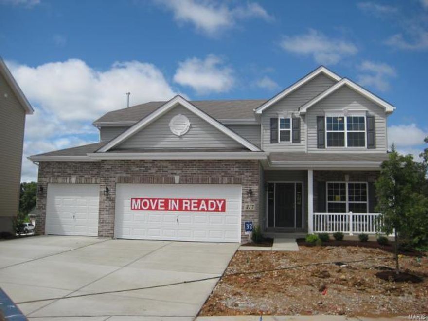 NEW HOME IN A HURRY! READY NOW!! Quiet neighborhood; country like setting surrounded by mature trees; 3 Car front entry garage with brick front and address stone, 8' walkout basement,9’ first floor height.  42" gas fireplace and marble surround and Mantle. Master Bath with double bowl and elongated and comfort height toilet and separate tub and shower. . Stainless Steel appliances with Gas Range and Microwave.  42” Cabinets with extended Island countertop and  adult high bath vanity in master. Island and Desk in kitchen.  Satin Nickel door hardware. Ceiling fans Master and Great room.  Recessed lighting in Kitchen.  Exterior Coach Lights. Zone heating and cooling.  Aluminum soffits and Fascia.  Window Wall in Great room as well as added kitchen Window and window in stairs. HDMI Above Fireplace. 3/4 bath rough-in.