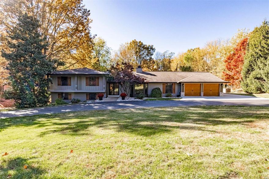 Wow - this beautifully updated & recently expanded Ladue home offers terrific living space & great floor plan! The amazing great room is the heart of the home with a soaring vaulted ceiling, gas fireplace, built-in office niche and a wall of windows overlooking the gorgeous back yard. The newer kitchen features stunning granite tile floor, beautiful cabinetry, granite counters & commercial-style stainless appliances. You will love the main floor master bedroom suite! Separated from the other bedrooms this private oasis features his & hers closets, add'l laundry, and a spa bath with heated marble floors, double vanity & generously sized shower w/ rain head. Upstairs you'll find a 2nd master suite with luxury bath (whirlpool tub, separate shower & double vanity), plus 2 add'l bedrooms & a recently renovated full bath.  The lower level features huge family room and 5th bedroom w/ adjacent full bath. You will love the fantastic living space, wonderful updates & beautiful lot ~ A MUST SEE!