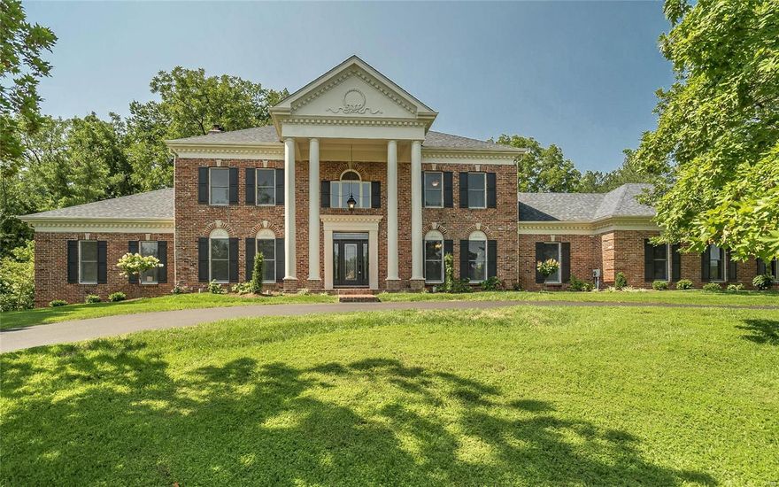 Magnificent 1.5-sty Estate home beautifully renovated to perfection! Wide brick porch entrance with architectural columns & exquisite leaded glass door leads to grand 2-sty foyer, private study with built-in bookcases, elegant dining room & spacious great room with floor-to-ceiling brick fireplace flanked by bookcases, wet bar & atrium doors that open to vaulted patio. Designer kitchen with custom white cabinetry, quartz countertops, commercial grade appliances & 9’ walnut center island adjoins sunlit breakfast room with wide bay window & convenient planning center. Sumptuous master bedroom suite offers an appealing  retreat with huge customized walk-in closet & marble bath with expanded shower & freestanding tub. Front & rear staircases access 3 generous-sized additional bedrooms & bonus loft room. Lower Level entertainment space includes recreation room with fireplace, gathering bar, game room & full bath. Situated on a 1+ acre lot overlooking pond with covered patio & 3-car garage.