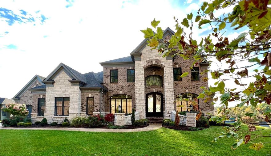 The layout of this 4 year old custom home was optimized to create over 8,000 sq. ft. of living space.  FULL BRICK exterior, beautiful landscaping, a 4-car garage courtyard, a sun deck, and covered patio with built-in grill. The flat back yard is perfect for your future pool. From the 2,000 lb. steel front door beneath a 20’ ceiling to the gorgeous modern kitchen featuring an enormous double-stacked granite island, commercial-grade appliances, and a sunroom with views to the backyard, you will realize this is not your ordinary home.  All three levels feature detailed construction of only the finest materials with a focus on comfort and style. Other special areas include a private main floor office, a loft/classroom upstairs, and a theater in the LL. The finished LL features a large party bar, rec room, 2 exercise rooms, a bedroom/bath suite, an additional private office, tall ceilings, and a walkout door. Garages feature custom storage racks, shelving, cabinetry, and a large workbench.