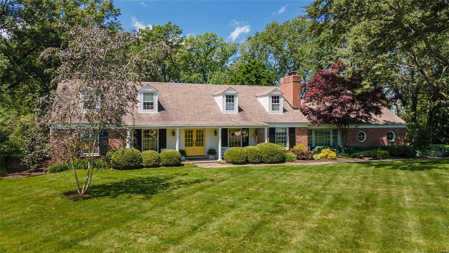 Classic 2-sty brick Colonial on parklike 1.7-acre grounds. Located in one of Frontenac’s most desirable neighborhoods. Gracious hardwood entry foyer leads to spacious living room with marble fireplace flanked by built-in bookcases, formal dining room and step-down family room with floor-to-ceiling brick fireplace, lighted bookcase & 2 walls of windows. Designer kitchen with bisque glaze cabinetry, granite countertops, commercial grade appliances & butler’s pantry adjoins light-filled breakfast room with custom breakfront. 2 Generous-sized bedrooms, 1 with ensuite bath, & office complete the main floor living quarters. Oak staircase accesses master bedroom suite with His & Hers customized closets & travertine marble bath with shower spa plus an additional ensuite bedroom. Lower Level entertainment space includes recreation room with gathering bar, game room & ½ bath. French doors open to outdoor living area with salt water pool & stamped concrete patio surrounded by landscaped gardens.