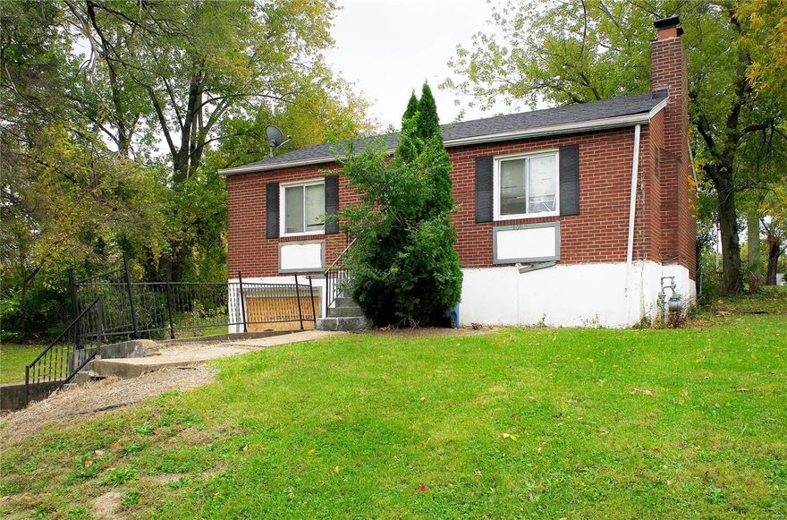 *COSMETIC FIX - INVESTMENT OPPORTUNITY * with this brick home situated on a corner lot. It won't take much to update this cutie! Built like a tank, with brick exterior, concrete foundation, and concrete flooring plus steel rafters exposed in the lower level ceiling vs traditional wood. It already has updated plumbing with PVC stack, vinyl windows, updated shingle roof (seller believes it to be around 3 years old) and updated electrical panel. If you add a garage door the occupant will have tuck under covered parking. Would be very easy for someone wanting a sweat equity home or a first investment property. Move in ready homes in the same subdivision have sold for $83k (2 bed 1 bath mls#22049993) and $150k (3 bed 2 bath mls#23053702). This home is being sold as-is. Seller will not do repairs, municipal inspections, and will not provide warranties. Special sales contract only with 2 business day response time.