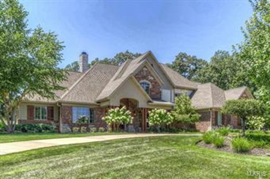 Welcome to this stunning, graciously appointed 1.5 story home – an estate perfect for entertaining and daily life. This setting is unique and breathtaking as home backs to 22 wooded acres, affording extreme privacy. Upon entering, you’ll love the soaring height of the great room, recessed bookcases flanking fireplace and the wall of windows featuring the amazing view of the pool. Foyer opens to both the gracious dining room with French doors and the office.  Master bedroom has stunning outdoor views, double closets and custom bath. Gourmet kitchen features cherry cabinetry, granite counters, top of the line appliances, gas cooktop & center island. Breakfast rm and vaulted hearth room with built-ins and stone gas fireplace open to kitchen. Enjoy your own private oasis with Pebble Tec pool (11), covered patio with fireplace and Wolf grill. Lower level walk-out includes full bath, family room with double-sided fireplace, mini kitchen and exercise room. 4 zones-HVAC, 7 zones-sound system.