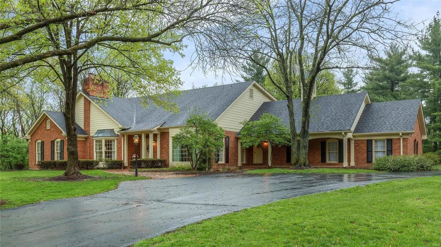 Exceptional craftsmanship & distinctive architectural elements define this elegant Higginbotham-built Colonial! Vaulted foyer leads to formal living room highlighted by marble fireplace, beautifully appointed  dining room & pecan-paneled family room with 10’ box beam ceiling, built-in bookcases, floor-to-ceiling brick fireplace, handcrafted wet bar & 2 sets of French doors that open to patio. Chef’s kitchen with granite countertops, 42” oak Wood-Mode cabinetry, premium appliances & butler’s pantry adjoins light-filled breakfast room with wide bay window. Sumptuous master bedroom suite radiates warmth with a 3rd fireplace, His & Hers walk-in closets & coffered bath with jetted tub. The 2nd floor extends the living quarters with 2 generous-sized bedrooms & full bath plus additional attic space—ready for finish. Newly carpeted lower level includes recreation room with bookcases & bar, media room & full bath. Situated on extensively landscaped 1-acre grounds with patio & 3-car garage.