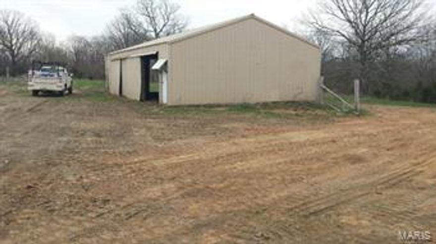 Large lot, level and cleared Home has a well, pond and large pole barn. SpecialListingConditions: Foreclosure