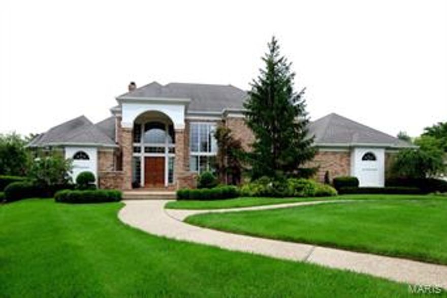 Spectacular Roy Beal built Estate home in premier gated neighborhood! Gleaming wood & marble flooring, soaring ceilings, architectural finishes & walls of windows with private lake views are only the beginning. Grand 2-sty marble foyer leads to stunning great room highlighted by floor-to-ceiling marble fireplace & elegant dining room. Marc Christian-designed kitchen with glazed cabinetry, granite countertops, Viking appliances & center island adjoins light-filled breakfast room & library-paneled family room with 3-sides marble fireplace. Coffered master bedroom suite with beautifully appointed His & Hers baths & 2nd bedroom suite/study complete the main floor living quarters. Front & rear staircases access 3 additional bedrms, 1 with private bath & 2 with Jack n' Jill bath. Incredible Lower Level features huge recreation room with wet bar, game room, media room, bedroom, office & 2 full baths. Impeccably landscaped ground include patio with grill, salt water pool (2014) & 3 car garage.