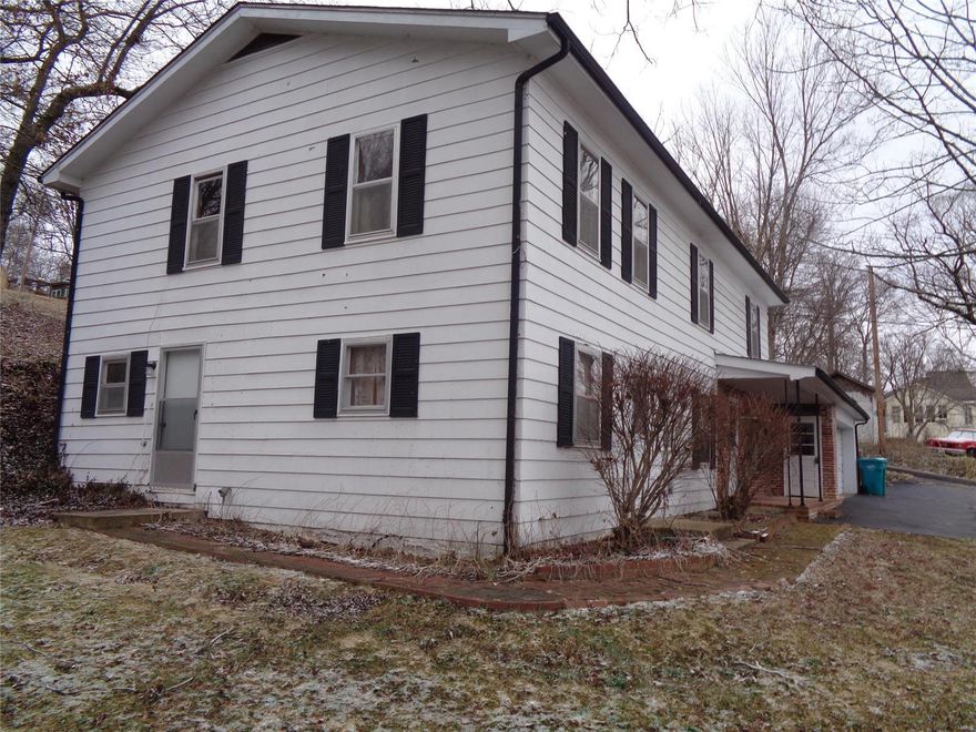 GET THEM IN THE GUESTHOUSE... and out from under your feet.  Find this big home with lots of space and tons of walk-in closets plus cute guesthouse with bath & kitchenette.  Need a big 2 car attached garage?  Here it is for you pull in luxury.  Fireplace greets you and guest to a cozy living room followed by a dining room.  The kitchen is eat in so if you looking for a den space, use the dining room.  There is a make shift bathroom in the basement attached to the kitchen but with your handy skills, it could be a beautiful 1/2 local.
Upstairs has big rooms, 2 big bathrooms and tons of space. Jack & Jill walk-thru closets are huge and craft rooms available or what you consider for your lifestyle.  The views are great since you are the King of the Hill here.  A shed is perfect for those with raw talent and the hardscaping and landscaping is eye candy waiting for your pruners.  This price lets you put in the effort to make this as beautiful home for your clan.