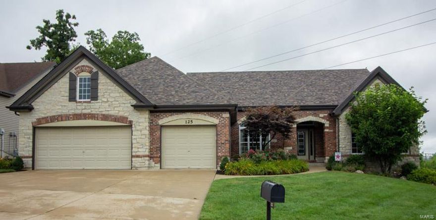 Stunning Atrium Ranch w/split bedroom floor plan. Pristine condition w/New Hardwood Floors on most of the main level. Office w/vaulted beamed ceiling and formal dining rm w/tray ceiling. Impressive Great rm w/Wall of Windows is adjacent to Kitchen & Hearth Room. Hearth rm w/Gas Fireplace and access to deck. Kitchen is loaded with custom 42 in. cabinets, tile backsplash, quartz countertops, stainless appliances w/gas cooktop. Main Floor Master has coffered ceiling, New Hardwood Floors, Walk in Closet, French Door to Deck. Master Bath has Tile Floors, Adult Height Vanity's, Jetted Tub, New Lighting. Deep Pour Walkout Lower level has New Carpet on the Staircase that leads to fantastic entertaining area with bar, family and Rec room, 4th bed and full bath plus huge storage area (2 walkouts) Home is loaded with Custom Woodwork, Sprinkler System, 2 Patios, 2 Yr. Old Roof, professional paint, 3 car garage & more. Quick Access to Biking/Walking on the Katy Trail. Just minutes to 364/Page Ext.