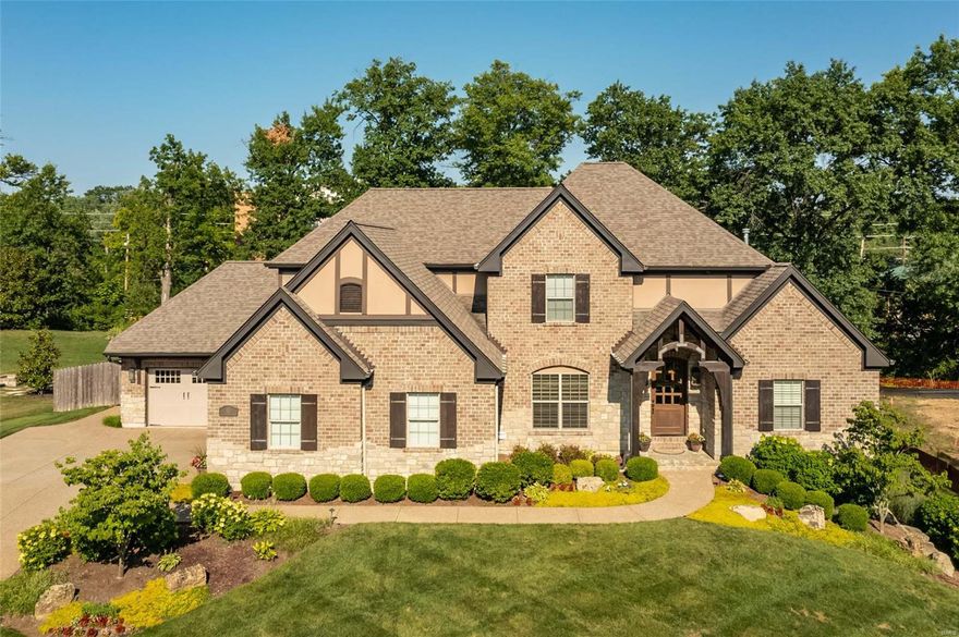 Exceptional custom built home on private lane in Ladue school district. Sophisticated & relaxed, open floor plan makes this 7 year new home the must have home of 2022. Sellers have created the ideal blend of living/entertaining spaces. Open floor plan features a gourmet kitchen with professional grade appliances, expansive adjoining eating area & stunning great room with hand crafted wood beams & stone appointments. 1st floor master suite has coffered ceiling & the ideal couples bath complete with 2 water closets, large walk-in shower, soaking tub & expansive custom closet.  Dining room is versatile & currently used as a wine room. 1st floor laundry and mud room are located off garage. 2nd floor features 3 large bedrooms and all rooms connect to a bath. Lower level is entertaining paradise with a family room, den/office area, bunk room, full bath and additional storage. Outdoor oasis features a covered patio with opulent stone fireplace, outdoor grill and exceptional, lush landscaping.