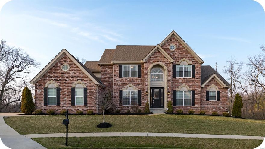 Gorgeous home in the prestigious Belle Maison neighborhood sitting on nearly 3/4 of an acre at the back of a private cul-de-sac. Stately full masonry front elevation highlighted by stone accents & tasteful landscaping. Step inside the impressive 2-story entry foyer flanked by spacious office & formal dining w/ butler's pantry, crown moulding & wainscoting. The jaw-dropping great room boasts soaring ceilings & stone fireplace. A gourmet kitchen guaranteed to please even the most discerning chef includes breakfast room w/ access to sizeable deck overlooking the beautiful backyard. Luxury awaits in the primary suite - dual walk-in closets, bay window, tray ceiling & simply stunning bath. The 2nd floor features a bedroom suite, 2 more generous bedrooms, full hall bath & bonus sitting room. Numerous upgrades including custom window treatments & light fixtures throughout, sprinkler system, 3-car garage, walk-out basement w/ roughed-in bath & patio make this handsome home truly one of a kind!