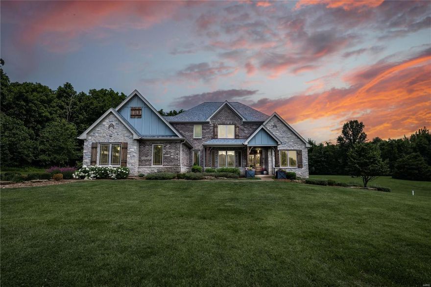 Stunning custom home in a gated neighborhood minutes away from downtown O'Fallon! 1 1/2 story home on 3.6 acres with oversized 4 car garage, on a cul-de-sac; 5000+ sq-ft of luxury. Custom front doors & beautiful sawn cut french oak floors greet you as you enter. The great room is open to the chef's kitchen with soaring ceilings, walk-in pantry, top of the line Jen Aire appliances, downdraft center island cook top, granite counters as well as a spacious breakfast room. The great room highlight is a see-thru fireplace to the of the amazing sunroom & walks out to firepit area; perfect for entertaining and overlooking the grounds. The main floor master bedroom & luxurious bath features a custom walk-in shower with 5 shower heads. The lower level, w/o has a fabulous theater room, rock wall/play area, wet bar/mini kitchen and additional spacious bedroom! 14 zone irrigation system, security system, prewired for pool/hot tub. Too many amenities to list - see attached feature sheet in MLS. Additional Rooms: Sun Room