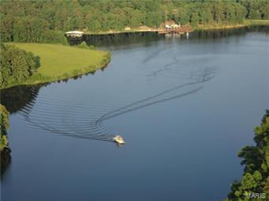 PRICE REDUCED, Buyer Will Consider Any Reasonable Offer!!! Secluded 680 acre ranch, borders National Forest-breathtaking. Stone/Cedar 6,200 sf Lodge, massive beams, wooden & stone throughout interior, massive fireplace, sunken bar. Deep 50 +/- acre Ski Lake, 13# Bass, 45# catfish, 1 ¾# bluegill, boat dock, swim dock, bath houses, white sand beach, & fire pit. Consistently produces trophy 140-175 whitetail deer & turkey. Miles of roads/trails, access to hundreds of miles of horseback trails. 32 acres of pasture, working pens & A+ fencing. $10-15K annualized timber income. Inground pool with pavilion, tennis court, par 3 putting green with two tee boxes. 12,000 sf commercial building; storefront, offices, conference room, and theatre seats 100. 2 add’l 2 BR & 1B houses. Hay barn, stable, dog kennel, equip & tack shed. 90 seat outdoor amphitheater, covered pavilion, 4,500 sq. ft. dance floor. Corporate retreats & weddings, championship designed 21 station sporting clays range.