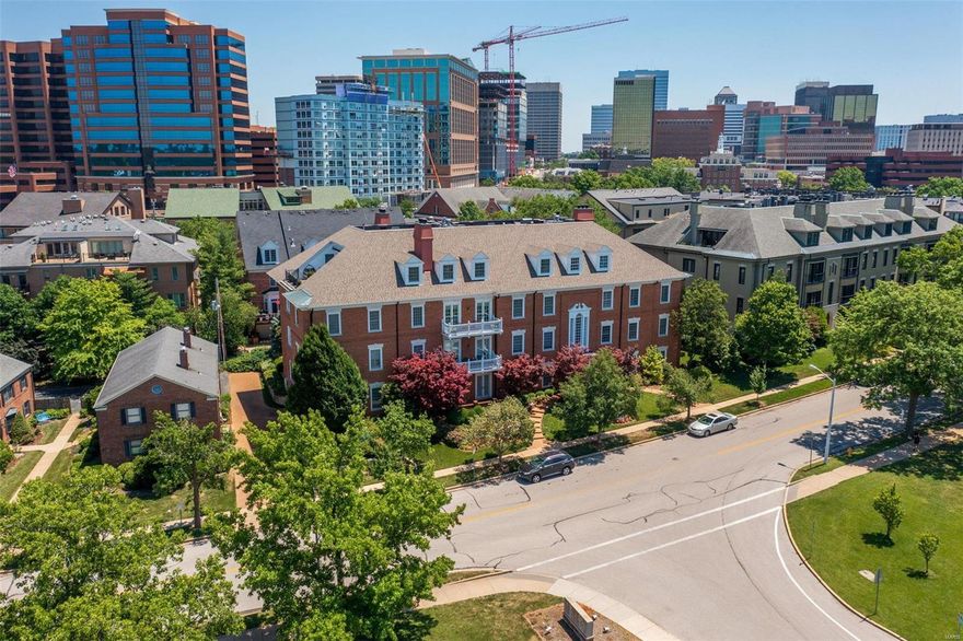 The minute you walk into this beautiful condo filled with natural light you will fall in love.  Hardwood floors, spacious rooms, a large chefs kitchen with custom cabinets and granite countertops, a beautiful dining room and French doors leading to the private balcony are just a few of the items that will immediately catch your eye.  Most rooms feature plantation shutters and just beyond the built in book cases you'll find a spacious master bedroom with walk-in closet and lovely adjoining bath.  The second bedroom has an additional full bath and could also be used as an office or den and has generous closet space.  There is an additional half bath near the kitchen with a spacious laundry room. Two assigned car spaces in the garage, two assigned storage units and you can't beat the location with just a couple minute walk to Shaw Park and Downtown Clayton.  Don’t wait to see this beautiful Condo and schedule your showing today!!!