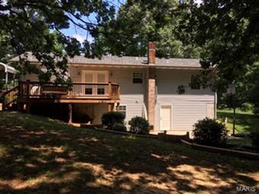 Private, updated and well maintained home on over 2 acres, minutes from town. This home could easily be 2400 sq ft with a walk out basement. Updates include bathroom with wood ceiling and tile shower, new sinks, new faucets, custom fireplace, treated custom 12X20 deck, French doors, concrete patio, outbuilding, and updated landscaping. Appliances included, wood furnace, electric back up, vinyl triple pane windows, 6 inch studded interior walls and much more.