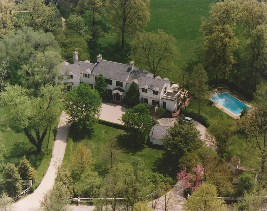 Picture one of St. Louis’ finest historic homes. White Bridge is an estate that represents the finest craftsmanship of an earlier era w all its appointments and elegant designs. Beautifully landscaped grounds. Straight out of an English country estate.  Ideally located in the middle of St. Louis and its finest homes. Ladue Schools. Looks out to an additional 2.5 acres. Rare view. Continual updates, fits the needs of today in convenience and luxury. Master suite starts w large bedroom. Master bath, a significant dressing room & closets. A large sitting room with its own fireplace. Bright open windows are throughout. Dining room and living rooms set up in a way you will find refreshingly usable. Great spaces. Library in the traditional warm sense. Built-in bookcases, beautiful fireplace and wood paneling. Large, subtle bar off this wonderful room. Kitchen and built-ins architecturally designed along w the breakfast room and deck. These overlook a pool so inviting you will jump right in! Additional Rooms: Mud Room