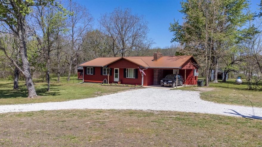 This Lebanon home for sale is just what you have been looking for. It is minutes to town on 1 acre with a real country feel.  Entering the spacious living room you will immediately notice the impressive floor to ceiling fireplace where you can showcase your prized possessions. The dining room flows seamlessly from the living room to the kitchen. It features a French door that leads out to the back patio, a great outdoor living space that is perfect for grilling this summer. The kitchen has oak cabinets & ample storage space to meet all your needs. The house has 3 cozy bedrooms, a well-appointed bathroom, and a room that's perfect for remodeling into a second bathroom. There is a shed w/electric used as a workshop/storage and a pole barn. The backyard has plenty of room for a garden or whatever you envision. With easy access to I44, commuting is a breeze. Located conveniently near Springfield MO, Lake of the Ozarks and Fort Leonard Wood.