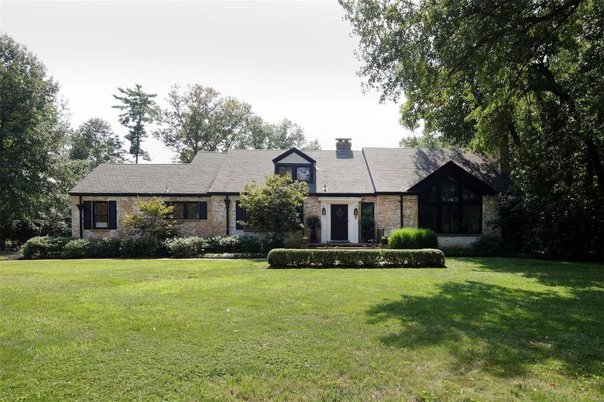 This stylish Ladue 1.5 story home situated on 1.65 acres and in a fabulous location.  The living room features a picturesque vaulted & beamed ceiling, a breathtaking leaded glass window, a stone fireplace, wood floors, & dramatic chandelier.  The large dining room leads into the newly updated eat in kitchen & hearth room.  In addition the main floor has a very emotional family room for additional living space with a 2nd main floor half bath.  The master suite is over the top with a gas fireplace as the focal point of the room.  The brand new master bathroom is exquisite with a separate shower & claw foot tub, double vanities, refrigerator, huge professionally finished closet with built in ironing board.  The 3 additional bedrooms are a very nice size.  The lower level has a nice rec room.  The premier level lot is appealing & private.  The new pool is a perfect addition & finishes off the backyard beautifully.  Lovely lighting throughout & so much charm!  Don't miss this special home.