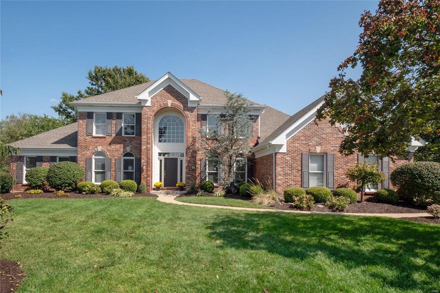 Discover sophisticated living in a prime West County setting! This stunning 1.5-story brick residence offers a perfect blend of timeless elegance and modern luxury, ideally situated near everything you desire. The main level features a serene primary suite with a spa-inspired bath, hardwood floors, and a dramatic two-story great room bathed in natural light. The updated chef's kitchen boasts quartzite counters, a center island, and seamless flow for entertaining. Upstairs, find three spacious ensuite bedrooms. The walkout lower level expands your living space with a fifth bedroom, full bath, gym, game room, wet bar, and cozy living area. Enjoy year-round outdoor living on the expansive screened-in deck with a gas fireplace. Benefit from unparalleled convenience with top-rated schools, several beautiful parks, premier shopping, dining, and major highways just moments away in this coveted location. Additional Rooms: Sun Room