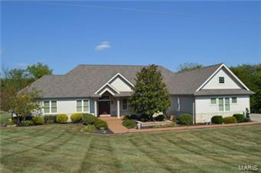 Must Call-Alarm!
 Spectacular custom home situated on 5 park-like acres that backs to woods.  Spacious ranch home w/open floor plan. The Great room features a wonderful gas fireplace, wall of windows, Arched entry foyer with crown molding and a formal dining area, large enough for those special events and family get to gathers. Kitchen includes 42"cabinets, granite counters, backsplash , butlers pantry, wine cooler, , multi level, wrap around Island that opens to the large gathering room where you can access the 20x22 covered deck and a adjoining 14x14 open deck w/steps to the inviting back yard.   Master bedroom has separate shower, garden tub, 2 vanities,  2 walk in closets. Mud room plus a large main level laundry rm.  There is crown molding and plantation shutters in most rooms, even the powder rm and laundry!
The walk out  lower level has 2 additional bedrooms, large family/game room with mini kitchen to make entertaining a breeze.
Almost 5000 sq ft - 5 acres- 3 car OS garage Additional Rooms: Mud Room