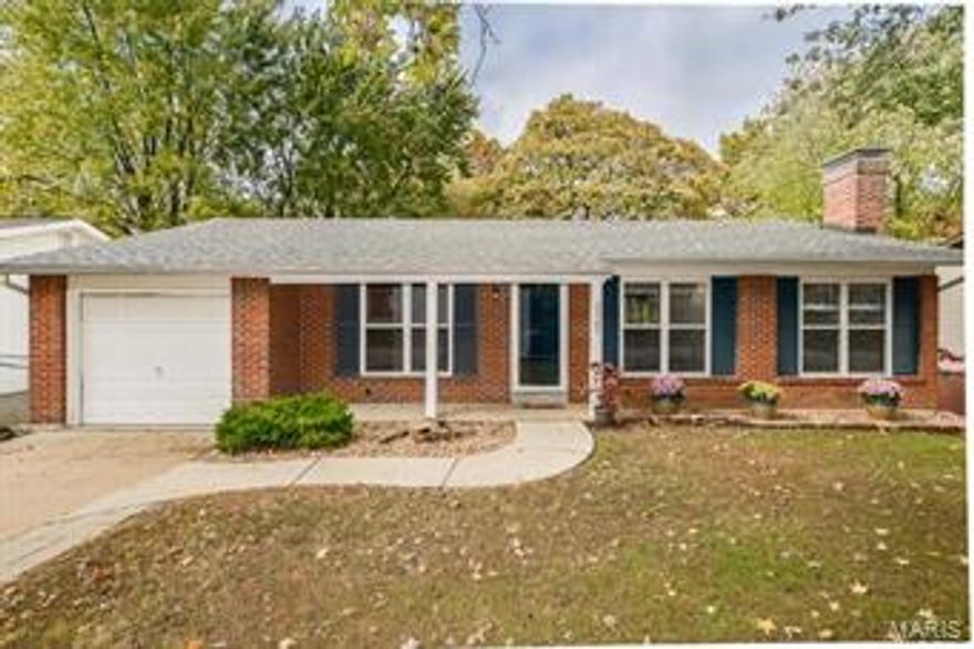 Gorgeous curb appeal cannot be missed in this 3-bedroom home located in the #1 RATED LINDBERGH SCHOOL DISTRICT!  This ranch style home features a welcoming front porch, followed by the freshly painted Living Room, which easily flows into an updated Kitchen & HUGE Dining area perfect for family gatherings.  From there you will be wowed by the peaceful, wooded views off the back deck.  Grab a cup of coffee & enjoy the view!  Down the hall, there is a hall bath, 2 good-sized bedrooms, & the Master Bedroom Suite w/ LARGE walk-in closet.  The lower level features addt'l living space with an oversized, full masonry fireplace located in the usable Family/Rec Room area.  Separate storage & Laundry areas also included, along with walk-out to the expansive & private backyard.  You will love relaxing amidst the park-like setting of this backyard!  Neutral paint colors, attached one-car garage, newer roof and furnace - Hurry, this one won't last long!