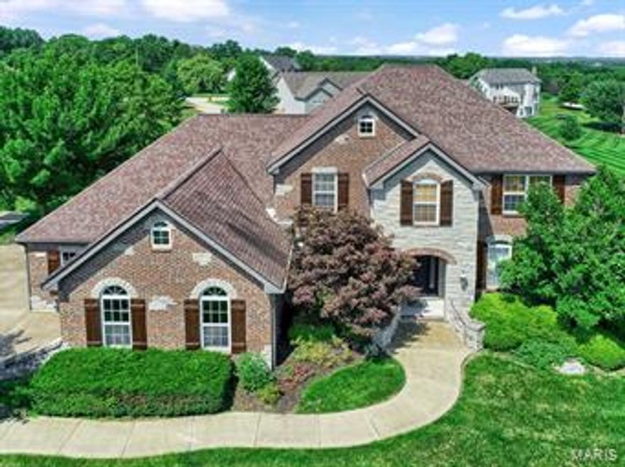STUNNING!!! This 1.5 story offers a terrific floor plan. The impressive entry opens to a lovely formal dining room w\elegant crown molding. The main floor boasts beautifully done maple wood floors. The living rm has a gorgeous stone FP. The spacious kitchen has plenty of cabinet space, a large center island breakfast bar, large pantry & upgraded stainless appliances. The main floor master suite has tray ceilings, bay window, an enormous walk in closet. The master bath is luxurious with dble sinks, make up vanity, newly finished tile shower. The upper level offer 3 nice sized bedrooms with all walk-in closets. The lower level is AMAZING, it offers plenty of room for entertaining w/a huge rec room, a wet bar with granite counter tops, office (could be a bdrm), exercise room & storage rm (well hidden). The outside has plenty of level play area, covered deck, stamped patio, sprinkler system. COOL: 14 SEER+