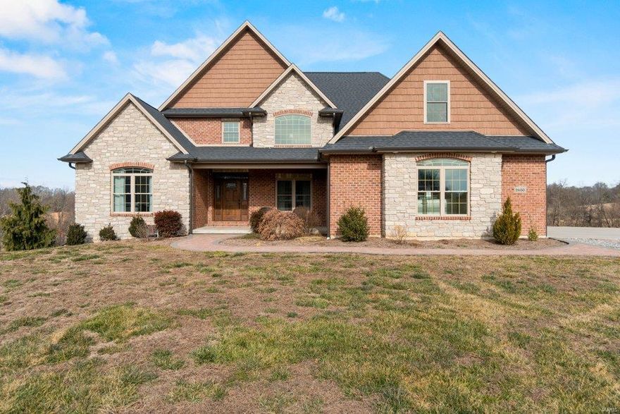 The sights and sounds of the country, minutes from Cape or Jackson, and a gorgeous home... 2650 State Highway Z checks these and more.  This stunning brick and stone, 5-year-old, 4500 sq ft. house sits on just under 16 acres of magnificent land, including a stocked pond. Countless amenities and features are included, 6 bedrooms, 6 baths, geothermal heating and cooling, 2-story stone fireplace... the list goes on!  Enjoy the breathtaking views of your private pond, while sitting on the suspended all-concrete deck, featuring under rail lighting and a built-in gas line.  A large, quartz countertop island will be the center for many of your friends and family gatherings while you enjoy cooking with the high end stainless appliances.  Entertaining has never been so easy with the open concept on the main level, the expansive lower level with a wet bar, and the vast acreage right at your finger tips.  This type of property doesn’t come around very often... Don’t wait to see this one!