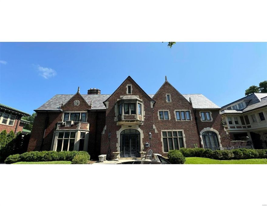 Classic Maritz & Young Tudor Revival built in 1929 across from 1,300+ acre Forest Park  This home has amazing architectural details through-out! Terrazzo floors, grand, circular staircase, elegant plaster moldings, intricately carved wood work & paneling. Gracious principal rooms, 2 enclosed sunrooms. Large primary w/ ensuite. Bonus room w/ vaulted ceiling on 2nd floor ideal for home office.  The living room is a classic English interpretation w/ its decorative plaster ceiling, simple wood-paneled design, & fine carved stone fireplace. The historic rear gardens complete w/ sunken garden, huge pool, large greenhouse + pool house w/ kitchen & full bath. Over 1+ acres just footsteps to the Washington University Danforth Campus & 5 min. to the BJC Med Complex.  This home displays some of the most unique interior & exterior fountains + 3 car ATTACHED garage.  This manse has such unlimited potential, it could be your dream home + offers everything that only the CWE can offer their residents. Additional Rooms: Sun Room