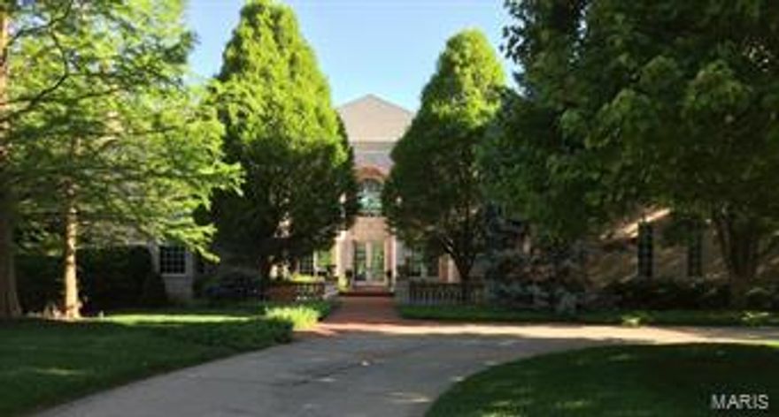 Breathtaking from the moment you walk through the doors. Gorgeous windows, tall ceilings, elegant chandeliers, exquisite moldings, interior doors & wood floors exude quality.  The kitchen w/ top-of-the line appliances, custom cabinets & granite counters adjoins the breakfast room & hearth room with vaulted T-Beam ceiling. Off the kitchen, a large main floor laundry w/ half bath leads to a 4-car garage.  The main floor master wing offers a study w/ handsome built-ins, bay window & marble fireplace just across the hall from the gorgeous bdrm suite w/ marble bath, large walk-in closets & vaulted ceiling over looking pool & deck.  Upstairs  3 additional bdrm suites w/ walk-in closets & bonus room.  An equally amazing LL, flooded w/ natural light, walks out to pool & patio & comes complete w/ entertaining area, media room, fitness room, rec room w/ fireplace, wine room, bedroom and full bathroom with steam shower and changing area.