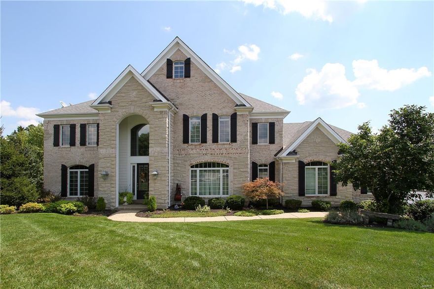 Gorgeous inside & out, this home will exceed your expectations. Relax in the backyard retreat with its panoramic views, lovely waterfalls & in-ground salt-water concrete pool. The 2 story foyer has wood floors & elegant millwork. An office is separated by tall French doors & has elegant millwork. The formal dining room has a beautiful chandelier & décor. An inviting family room features a large bay window, built-in shelves & a lovely wet bar. The expansive kitchen is the perfect gathering place with a center island, large breakfast bar, granite counters, beautiful cabinets & stainless appliances. It opens to a wonderful breakfast room & hearth room with a vaulted ceiling & brick fireplace. The master retreat features a vaulted ceiling, twin closets & a deluxe master bath. The upper level is also served by 3 lrg add’tl bedrooms with a private bath & jack n jill bath. Enjoy entertaining in the lower level with a huge rec rm, media rm, exercise rm & full bath. Don’t miss the 3-D tour!