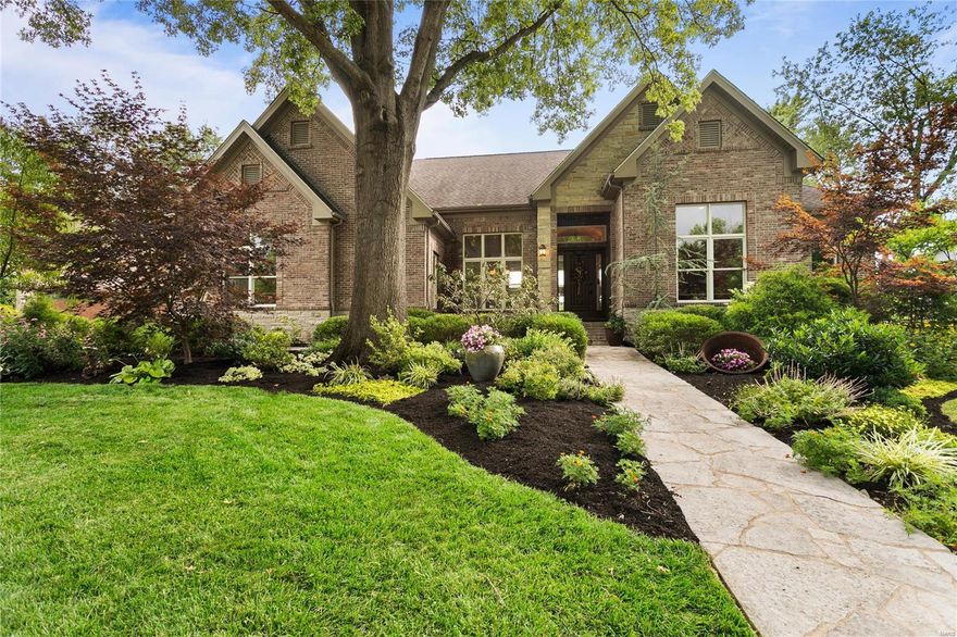 Casual sophistication awaits in this custom brick & stone ranch! This truly unique floor plan offers multiple generous living spaces while maintaining a feeling of warmth. Featuring barreled ceiling entry, 13’ high ceilings, Asian Walnut flooring, private office with double doors, dining room & great room with floor to ceiling stone FP & wall of windows. Designer eat-in kitchen offers SS Bosch appliances, center island w/prep sink, ample storage & 17’ of counter dining. The split bedrooms, each with their own private bath, make everyday living easy. Open staircase leads to the expansive Lower Level boasting slate floors, family room with stone FP, wet bar, rec. room (pool table included), fitness room, 2 bedrooms, 2 full baths & plenty of storage! Lavish landscaping provides four seasons of beauty in both the front and back. Enjoy flagstone paths and patios surrounded by easy care perennials. Centrally located, walk to schools, parks, shops & restaurants.