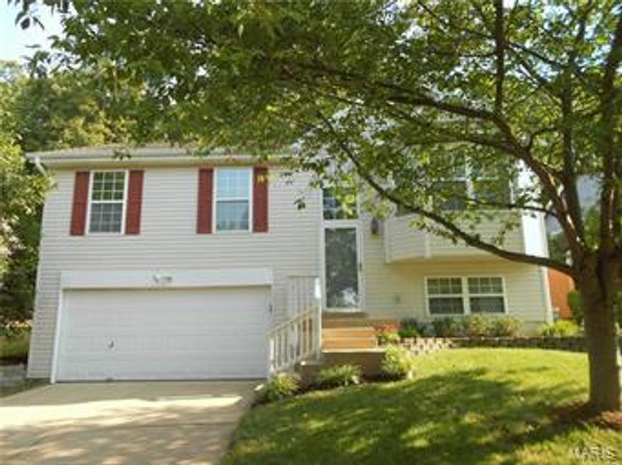 A must see 3 bdrm, 2 bath, 2 car garage move in ready home in Woodlyn Crossing!  AAA Parkway Schools! Highlight include: Bright and Cheery home w/ lots of natural lighting!   Soaring Vaulted ceilings in Great room, Kitchen, dining and Master bedroom!  Thermal tilt- in windows! Freshly painted interior! New flooring throughout 2015!  Low maintenance vinyl siding w/ enclosed soffits and fascia! Master suite w/ adjoining updated full bath! Updated hall bath 2015!  Lovely patio off Dining area-perfect for BBQ or relaxing! Lower level could easily be additional family room/ bedroom and has rough in for 3rd full bath!  Refrigerator and work bench in garage negotiable! HSA home warranty free to purchaser  Move-in ready! Show & Sell!