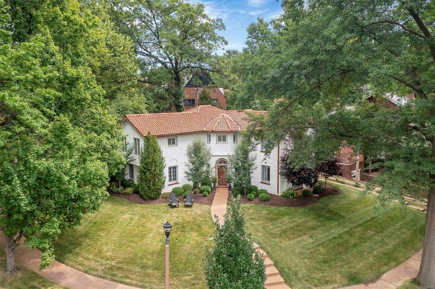 This University Hills gem perfectly marries historic elements w/ modern updates & professional design. Mosaic tile foyer & grand arches welcome you to the living room w/ gorgeous built-ins, extensive lighting, & stately fireplace. The hub of the home is a family-friendly kitchen & dining room w/ banquette seating, large island, Sub-Zero fridge, wet bar & pantry. A bonus room off the kitchen makes a perfect den, office or formal dining room. A mudroom, laundry & powder room round out the first floor. Upstairs, French doors lead to a well-lit den, office, or playroom. Down a private hall, a spacious primary suite awaits featuring custom drapery, a huge shower, dual vanities & walk-in closet. 3 more roomy bedrooms & large hall bath complete the upstairs. Outdoors, the sweeping corner lot w/ mature trees & pretty landscape is the perfect setting for evening drinks as you greet friendly neighbors passing by. Entertaining is a delight with expansive hardscapes & custom banquette dining area.