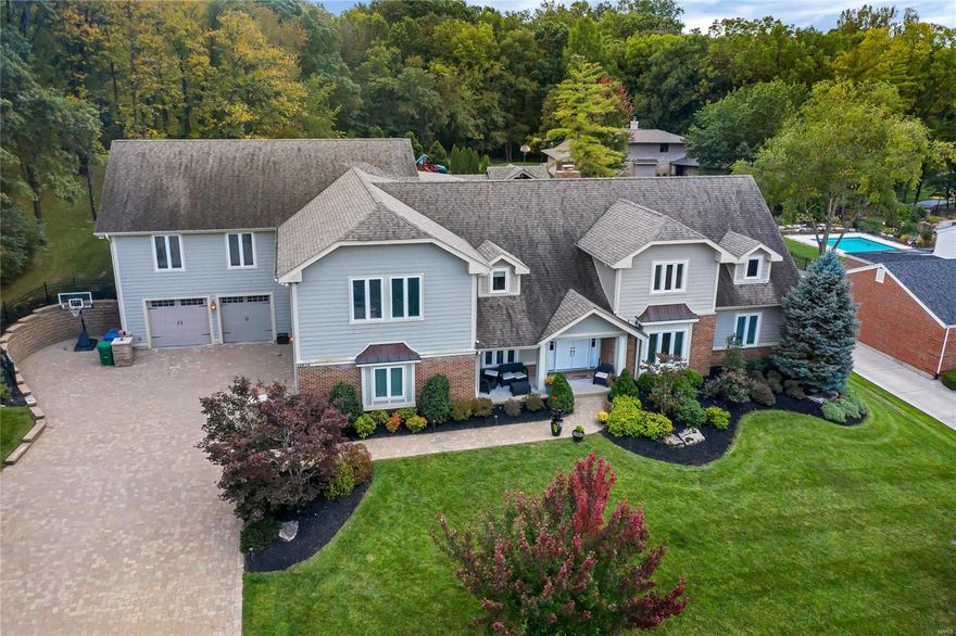 An entertainer's dream in the highly desired Bradford Woods neighborhood. Offering over 9,000 square foot of living space, this 4 bedroom, 7 bathroom home is one you will have to see to believe. The main floor features a gourmet kitchen, vaulted ceiling great room, formal dining and living, main floor master suite, breakfast room, and mud/laundry room. Three staircases take you up to a second floor master suite, 2 additional bedrooms, another laundry room, and 4 large recreational rooms. The basement is perfect for a home theater, large craft space, additional recreation areas, and a customizable wine cellar with a secret trap door and spiral staircase that opens up into the main floor kitchen/breakfast room. The back yard offers a resort lifestyle you will never want to leave. A large heated salt water pool, a natural gas fire feature, and two levels of incredible teak wood decking create the perfect space for entertaining or your own personal retreat. Additional Rooms: Mud Room, Wine Cellar