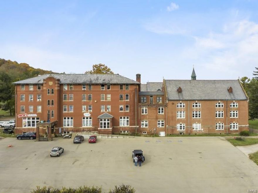 Excellent value-add business opportunity with multiple revenue streams on this beautiful historic property.  Seven buildings totaling over 70,000 square feet sit on approximately 15.27 +/- acres in beautiful Arcadia, MO just outside Mark Twain National Forest, Taum Sauk Mountain State Park, Elephant Rocks State Park, and Johnson's Shut-Ins State Park.  Originally built in phases from 1902 to 1930, the former Ursuline Academy school now houses a restaurant, bakery, ice cream shop, gift shop, overnight suites, a bed and breakfast, a gymnasium, a theatre, and a wedding chapel highlighted by beautiful architectural features and stained glass that would cost millions to reproduce today.  The 250-seat theatre, erected in 1920, hosts seasonal performances and events.  The gymnasium, built in 1930, contains an original, pristine, Lemella roofing system and herringbone wood floors.  It can host as many as 500 guests.  Don't miss out on your chance to own a piece of history! Location: City, High Traffic, Hwy/Interstate Frntg