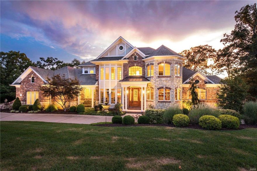 Stunning 1.5 story custom home situated on 1.87 acre premium lot. Main floor features 20' entry foyer w/mahogany & etched glass front door. Spacious dining rm. w/ 4 bay window & Brazilian cherry wood flooring. Study boasts built in bookcases, desk, filing cabinets & beamed ceiling. Expansive gourmet kitchen features granite counter tops, breakfast bar, tile backsplash, 42" cabinets, 5 burner gas stove, double oven, 2 dishwashers, under counter refrigerator, separate ice maker, butler's pantry & plenty of windows for a spectacular view of secluded backyard & outdoor entertainment space. 2 story great rm. w/4 sets of floor to ceiling windows, gas fireplace with impressive brick herringbone pattern &  built in entertainment center. Expansive master bedroom offers private sitting rm. & deck, 2 walk in closets, luxury master bath, 2nd level w/3 bedrooms, wood floors & ensuite bathrooms w/granite vanity tops. Professionally finished walk out LL w/5th bedroom, full bath, family & rec room.