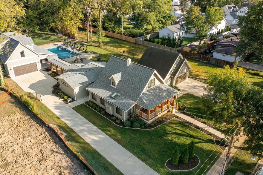 Don’t miss the opportunity to own this luxe estate located in the heart of Kirkwood! Entertainer's ideal home w/massive, 33,700 square foot, fenced lot featuring a private inground pool, covered patio w/outdoor kitchen & plenty of green space. Boasting an open floor plan & over 5500 square feet of living space in the 5 bed & 4 full bath footprint this home has. Work easily from home, offering 2 office spaces! The expansive & modern kitchen you'll find white quartz countertops, impressive island, all wood soft close cabinets, premium stainless steal appliances, large pantry, & designer light fixtures. Conveniently located main level master bedroom w/full ensuite bathroom. A cozy den area w/gas fireplace & sky light will be great for upcoming seasons. You'll appreciate the drop zone area & tons of storage.