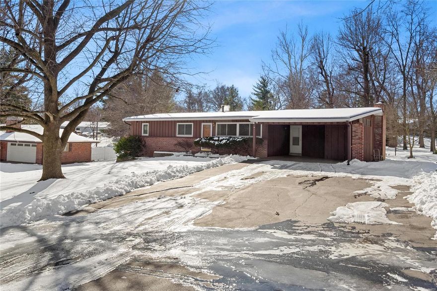 Welcome to this charming 3-bedroom, 2-bath ranch in the coveted Kehrs Mill View neighborhood, within the award-winning Rockwood School District and Marquette High boundaries! Nestled on a spacious 0.53-acre lot, this home features a cozy fireplace, 2-car carport, and timeless updates: refinished wood floors, fresh paint, crown molding, and updated outlets in 2022. The kitchen was updated with soft close cabinets & quartz counters.  The fuse panel was upgraded in 2016 & a new water heater installed in 2023. Enjoy peace of mind with wiring for a backup generator and a Seller-paid Home Warranty. Deer may even greet you in your serene backyard!