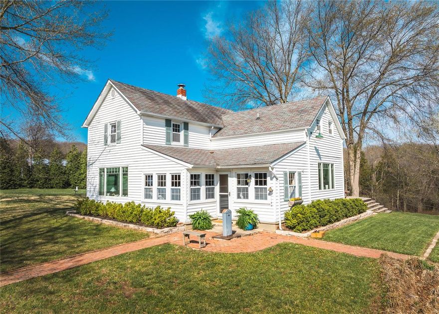 Harvest Moon Farm in Hermann, a 20-acre estate in wine country. At the heart of the estate a 1915 Midwest farmhouse renovated in 2017. The 4bed, 2bath main home has custom cabinets, countertops, original woodwork & re-finished original pine floor planking, new appliances, a whole-house generator and a 1000 gallon buried propane tank. A 40 x 40 detached 2-car garage provides space for vehicles, storage, tools and landscaping equipment.  Apart from the main residence is an 1800 sq ft newly constructed building, which serves as an art studio/workshop/"in law" suite w/bed, full bath, full kitchen & central HVAC. Workshop area of building fully heated and room for farm equipment. Furthermore, the renovated original 1850s log cabin graces the estate. Also, a 1-acre stocked lake with a charming bridge and dock. A 900 sq ft cedar “infinity deck".  Partially fenced with 9.5 acres of lush pasture for deer & turkey, which easily could be made a horse facility.