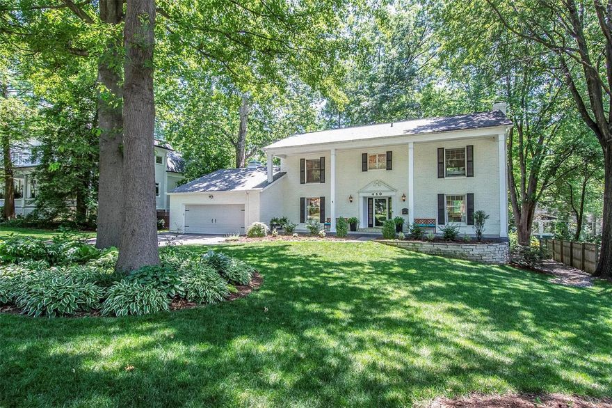 Est. 1978. Gorgeous landscaping and covered porch welcome you to this 4 bed/3.5 bath Colonial home located in the sought-after Webster Park neighborhood. Center hall floorplan with 2 story entry foyer. Light-filled LR offers beautiful built-ins and woodburning fp. Elegant formal DR with custom moldings. The eat-in kitchen boasts custom cabinetry, granite countertops, Sub Zero built-in side by side fridge, 6 burner gas cooktop, double oven and pantry. Another woodburning fp with brick surround and hearth in the spacious FR. The 3 season room overlooks the backyard and patio - the perfect place for indoor and outdoor entertaining! Primary bedroom with en suite bath and separate closets. 3 addt'l good-sized bedrooms.HUGE unfinished walkout LL with bath roughed in is just waiting to be finished. Main floor laundry. 2 car attached garage. Walkable to local schools, parks and downtown WG offering fantastic dining and shopping. Check out 410 Oakwood and all it has to offer before it's gone! Additional Rooms: Mud Room, Sun Room