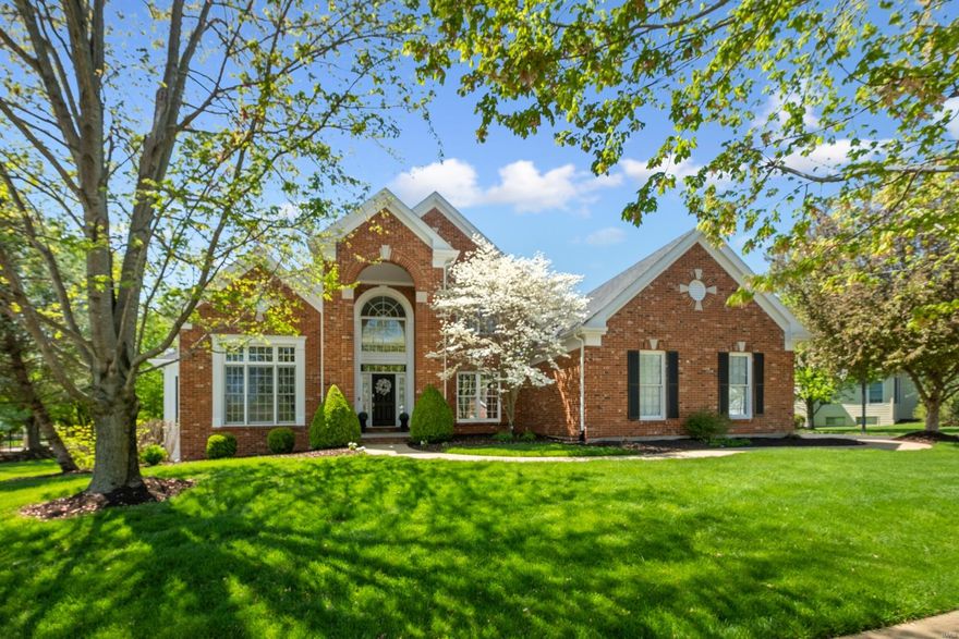 Experience Pine Creek elegance. Enter to a majestic flared staircase that leads to a grand foyer and a two-story great room boasting 18-foot ceilings, a warm gas fireplace, and a magnificent wall of floor-to-ceiling windows. The gourmet kitchen boasts granite countertops, a center island with a gas cooktop, updated stainless steel appliances, a double wall oven, and a planning desk. The adjoining vaulted hearth room exudes a warm and welcoming ambiance and boasts a gas fireplace. The elegant formal dining room is adorned with crown molding, and accompanied by a butler's pantry. A handsome office space awaits, equipped with custom-built cabinetry. The spacious main-level primary suite features walk-in closets, dual granite vanities, a Jacuzzi tub, and a water closet. The upper level boasts three bedrooms, each with walk-in closets and two full baths. The lower level features a family room with a cozy gas fireplace, full bar, hobby and exercise room, 3/4 bath, and wine cellar.