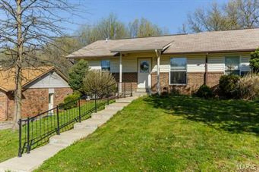 Stunning home loaded with updates. Fabulous vaulted great rm opens to kitchen featuring newer 42" cabinets w/built in pantry, tons of counter space, updated appliances, ceramic tile flooring and custom wood inlay flooring in breakfast room. Spacious bedrooms and updated bath make this a move in ready home. Additional updates include newer carpeting, windows, sliding glass door and fresh paint. Step out on to large deck overlooking your treelined fenced backyard. An oasis to relax or entertain in.  Lower level features a family room and den/sleeping area with a full bath aswell.  The oversized 2 car garage with additional work area is a dream. Located close to hwy access, shopping, dining, parks and walking trails.  No monthly association fees. This is a home you won't want to miss.