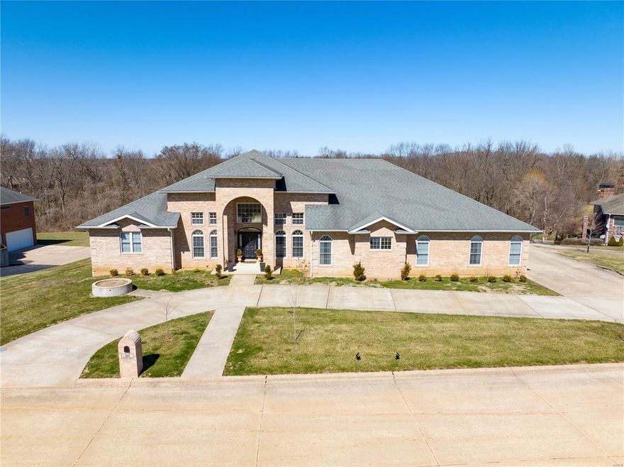 Newly renovated, large luxury home, in one of the best neighborhoods in town! This sprawling 5 bedroom, 3 bathroom, fully bricked, ranch home features a large kitchen that is open to the living room  - complete with built in bookshelves and a stone floor to ceiling fireplace. The office/den is right off the foyer and piano room as well. The office could also double as a nice nursery, media room, or 5th bedroom. The master bedroom suite is enormous and offers an en suite bathroom, his and her closets, and walk out access to the covered back patio. The back yard is expansive with beautiful views of both woods and wildlife. The full unfinished basement is a blank canvas for your finishing preferences. The theatre room, two sleeping rooms, and a 4th bathroom and additional 1/2 bathroom are framed/roughed in. The neighborhood is great for families and is very welcoming! You will often see kids biking and neighbors walking their pets. Schedule your showing today!