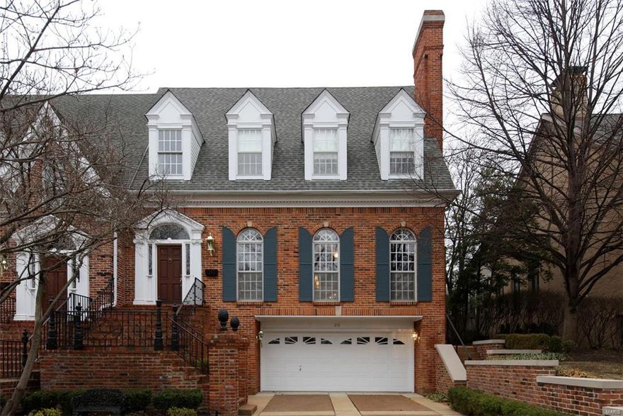 Traditional home in the Heart of Old Town Clayton. This luxury residence lives like a single family set on a private 50x160' lot backing to Taylor Park.  2 story foyer is light filled. The main floor has great proportions with 10' ceilings. Formal living room features tall windows with arch transoms, a stately fireplace & hardwood wall paneling. Retreat to the library & surround yourself with a warm fireplace & sophisticated stained wall paneling, box beam ceiling, bookcases & a wet bar. Formal dining with white painted wainscoting & detailed beam ceilings. Main floor master suite has a fireplace & spiral staircase that leads you to a second HUGE master closets/dressing rm retreat & full bath. Custom kitchen has solid surface tops, high end appliances and opens to breakfast room & french doors that leads to an expansive fenced rear yard patio. 2 beds/2 baths on 2nd floor with 9-1/2' ceilings. Large 3rd fl attic closet. 3 car garage with epoxy floor. Large nicely finished lower level.