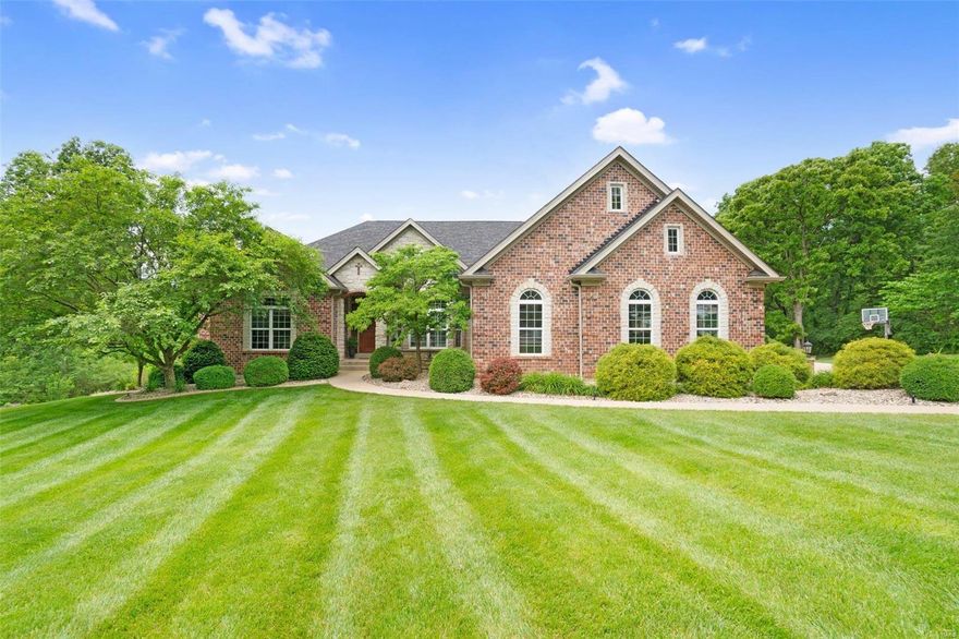 Welcome to your dream home! This stunning property offers a spacious 6,811 sqft of luxurious living space nestled on 5 pristine acres. With 5 bedrooms, 3 on the main floor & 2 in the lower, & 4.5 bathrooms there's ample space for everyone. 

An impressive open-concept layout with hardwood floors throughout, elegant 12-foot decorative ceilings, & three fireplaces; but the heart of the home is in the kitchen! Featuring granite countertops, custom tile backsplash, a walk-in pantry, SS appliances, and a separate dining room. As you descending to the lower level the entertainment options abound with a second kitchen, theater room, and a pool. Don't forget the oversized garage, ample storage space, and an additional laundry room in the basement all for added convenience. 

Relax in the screened-in porch or take in the breathtaking views from the walk-out basement. This home blends elegance, comfort, & functionality —schedule your showing today & experience luxury living at its finest!