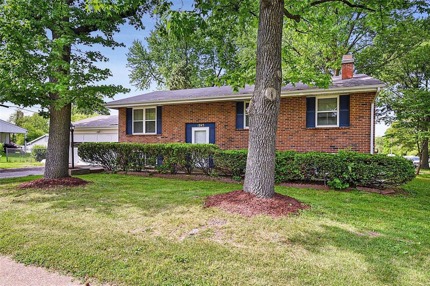 Welcome home to this BEAUTIFUL 4 bdrm, 2 full bath, corner lot w/ 2 car garage!   This split level home has beautiful refinished hardwood flooring, new coat of paint throughout, all new doors including closet doors, all new light fixtures, new carpeting in 2 lower level rooms, a ONE year old roof & a central vac.  Kitchen boasts of stainless steel appliances including GAS stove, SUBWAY TILE backsplash, pantry and TILE flooring. Nice size living room, dining room, 3 bdrm, 1 full bath, coat closet & linen closet completes the main level. Lower level has great room w/ BRICK FIREPLACE, 1 bedroom, 1 BONUS room & 1 full bathroom w/ GORGEOUS tiled stand alone shower!  Walk out from the sliding glass door from your dining room to your fenced-in backyard, RELAX and enjoy the HOT TUB year round! Hurry and make your appointment NOW!