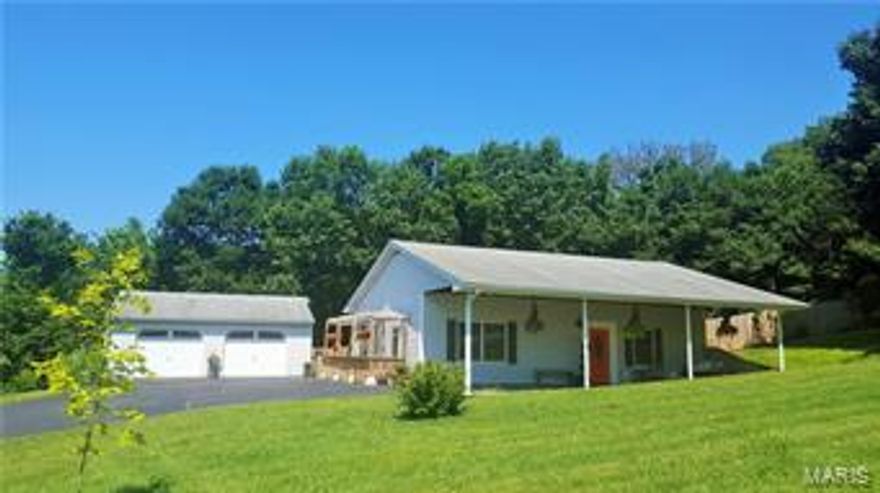 NO SHOW until Saturday at 10 a.m. Adorable single level living ranch with professionally landscaped yard. As soon as you pull up, you will notice how gorgeous the landscaping & yard are. Nearly 1 acre of land with a fenced back yard backing to trees. Upon entering you will notice all of the updates the sellers have completed: newer carpeting, neutral paint, updated appliances, back splash, lighting, etc. Open floor plan w/ vaulted ceiling. Kitchen, dining, great room combo ideal for not being away from the action while in the kitchen. There are 2 bedrooms and one bath with a main floor laundry. Huge covered front porch/patio, Pergola walkway from French doors leading to backyard & over-sized 2 car garage. The backyard has a privacy fence, a small pond & tons of beautiful landscaping. Long driveway w/ plenty of parking. Own this little piece of heaven just minutes from Union & sitting in the lovely subdivision of Worthington Place although this property is NOT part of the subdivision.